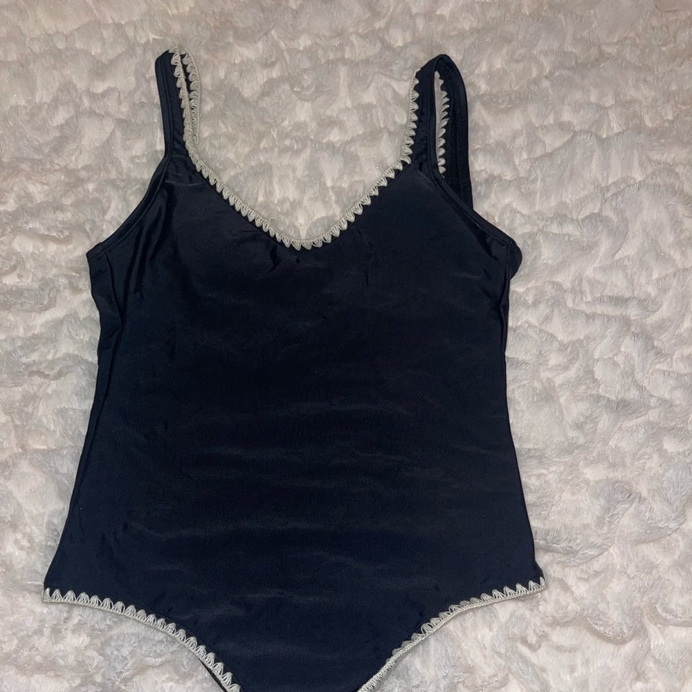 Women’s black one piece with detail